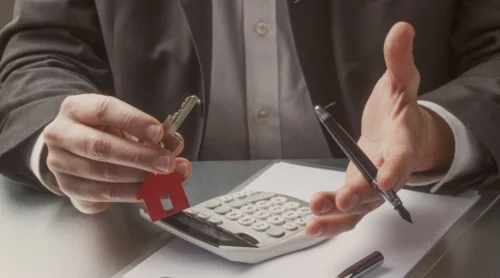man with key calculator and pen lexington ky